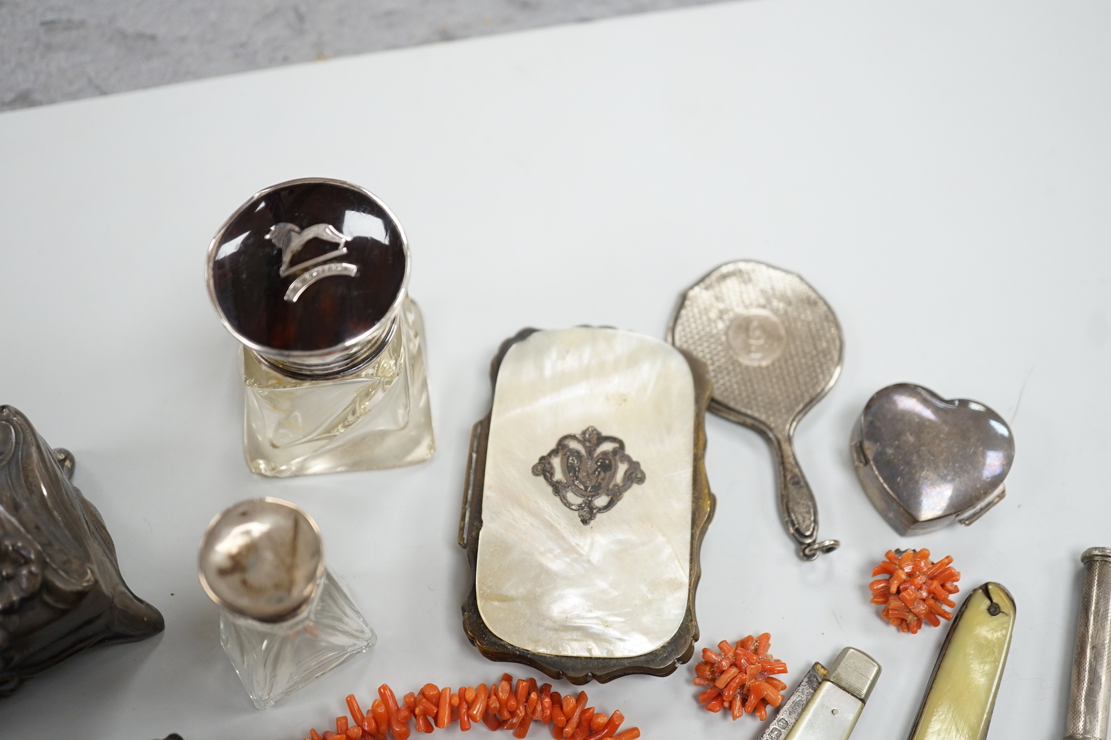 Mixed collectables including silver and tortoiseshell mounted glass toilet jar, miniature hand bag mirror, silver heart pill box, fruit knife, mother of pearl mounted purse, etc.